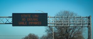 overhead highway sign reminding drivers to drive sober