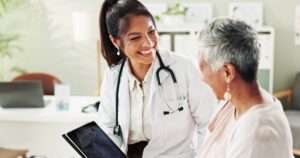 older woman with female doctor taking a look at xray