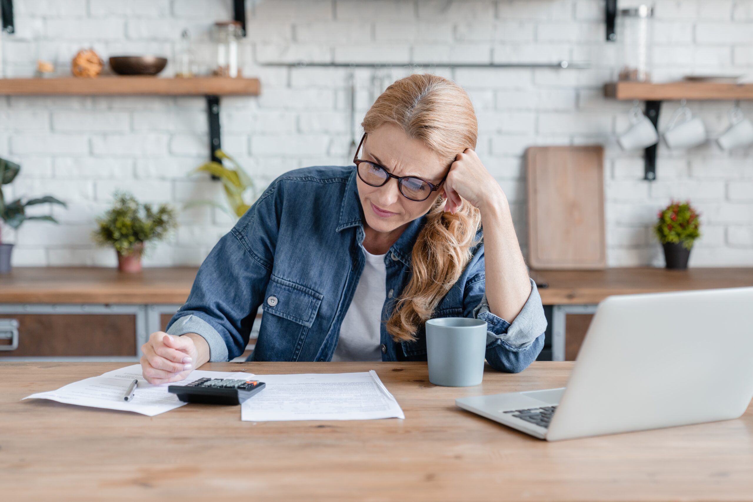 confused and angry woman reviewing documents