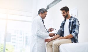 doctor and patient with blood pressure test