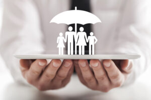 businessman protects family members with an umbrella