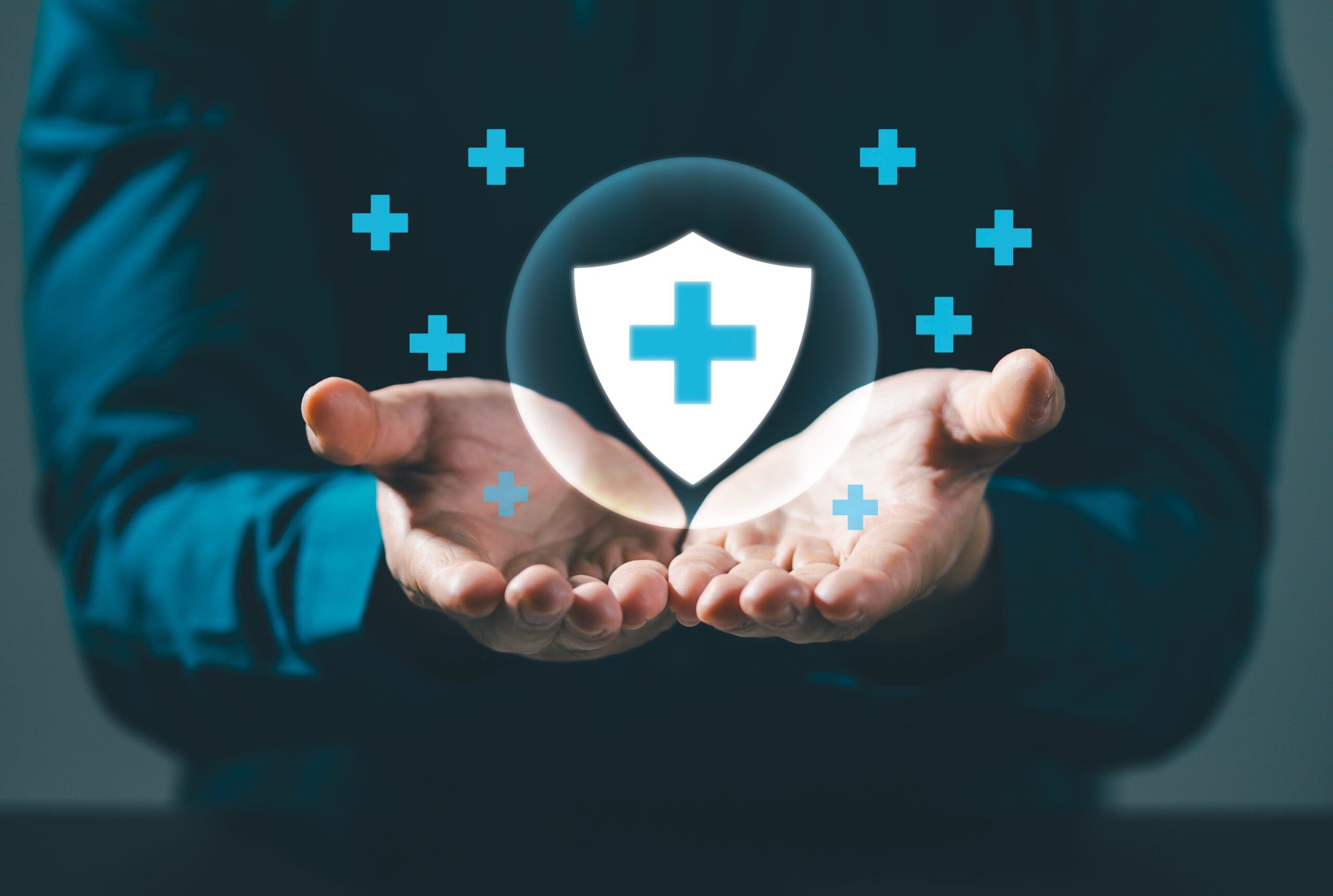 health insurance with medical symbol held in hands