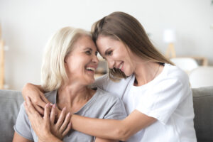 happy aging older mature mother and millennial daughter