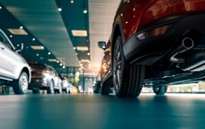 cars lined up in luxury show room