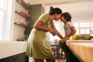 affectionate mother touching noses with her young son