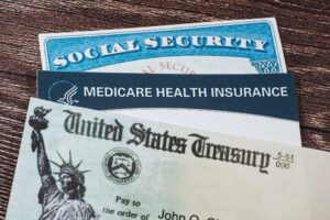 ssn and medicare cards with a us treasury check