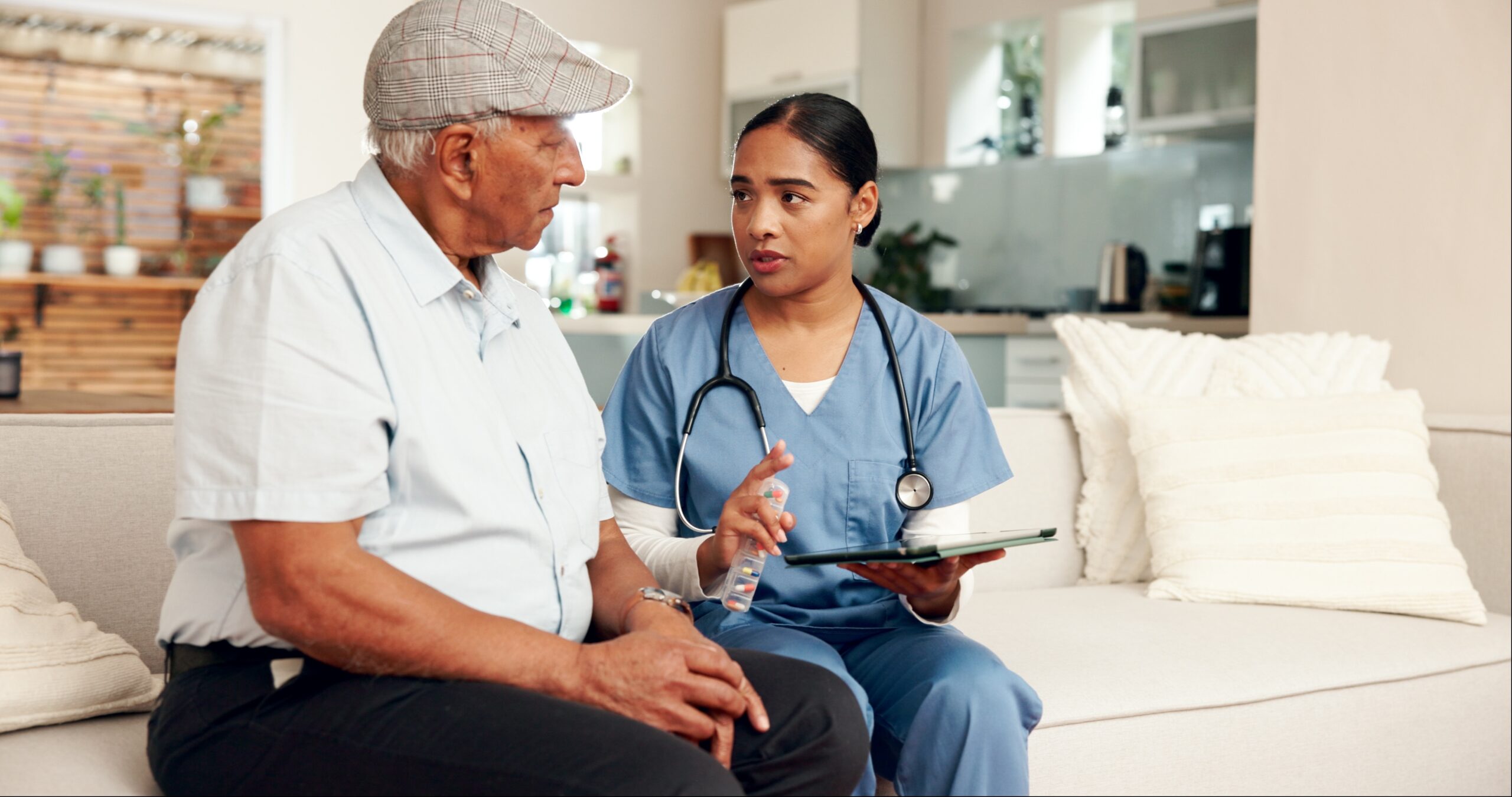 elderly man and doctor sitting together during consultation