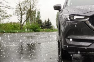 modern car parked outside in hail storm