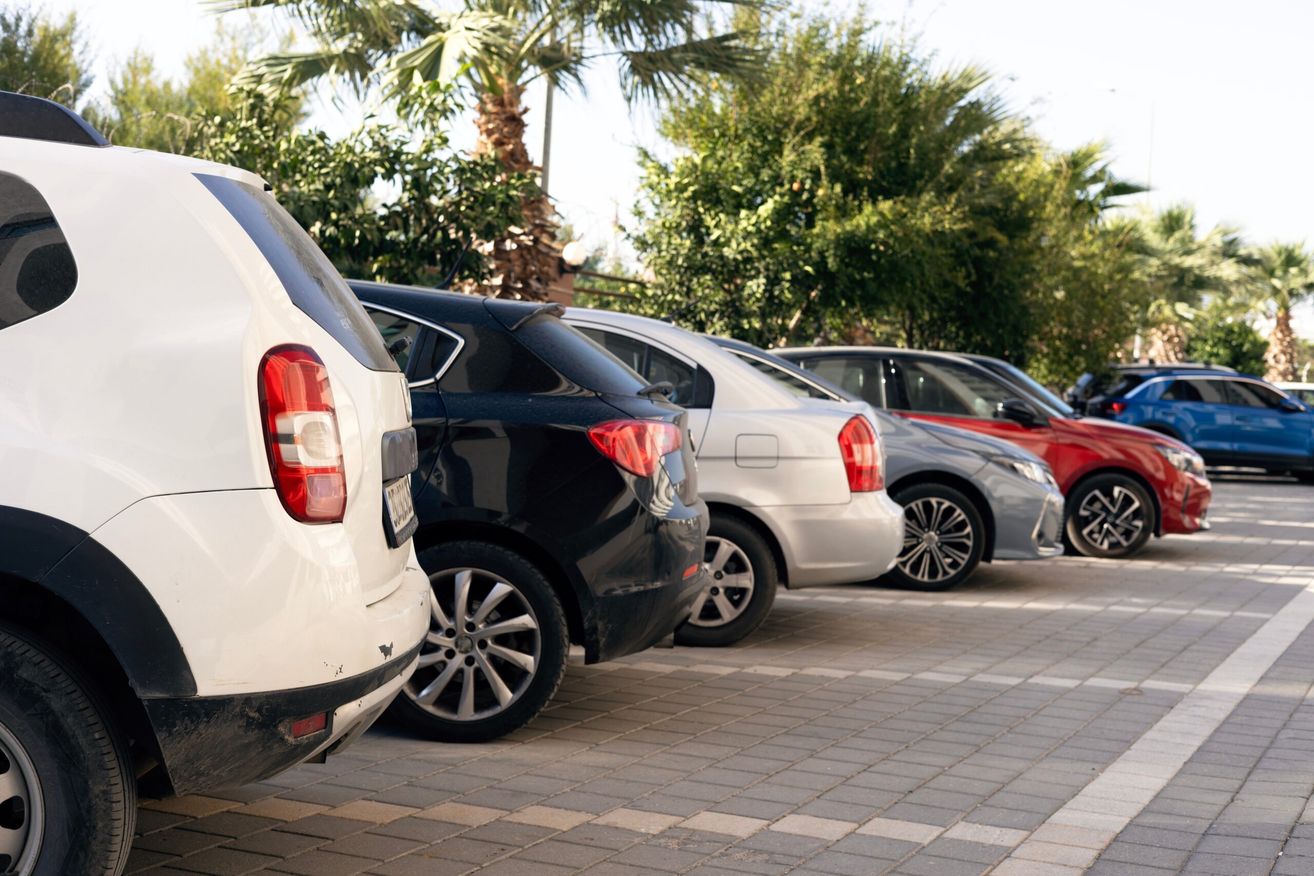 a row of vehicles in a parking lot