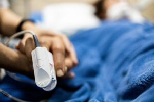 patients hand with pulse check