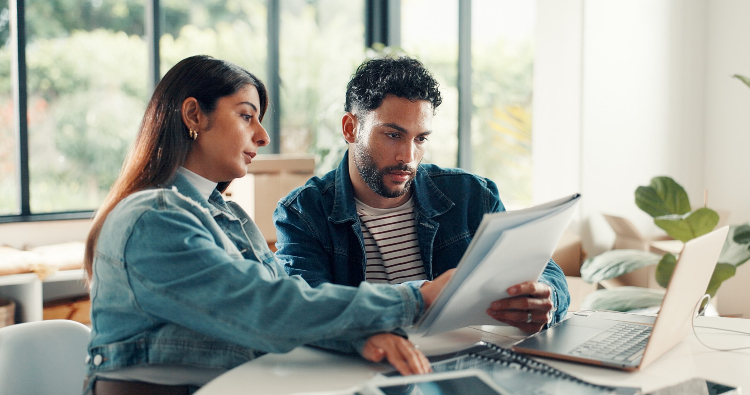 couple in their home discussing documents