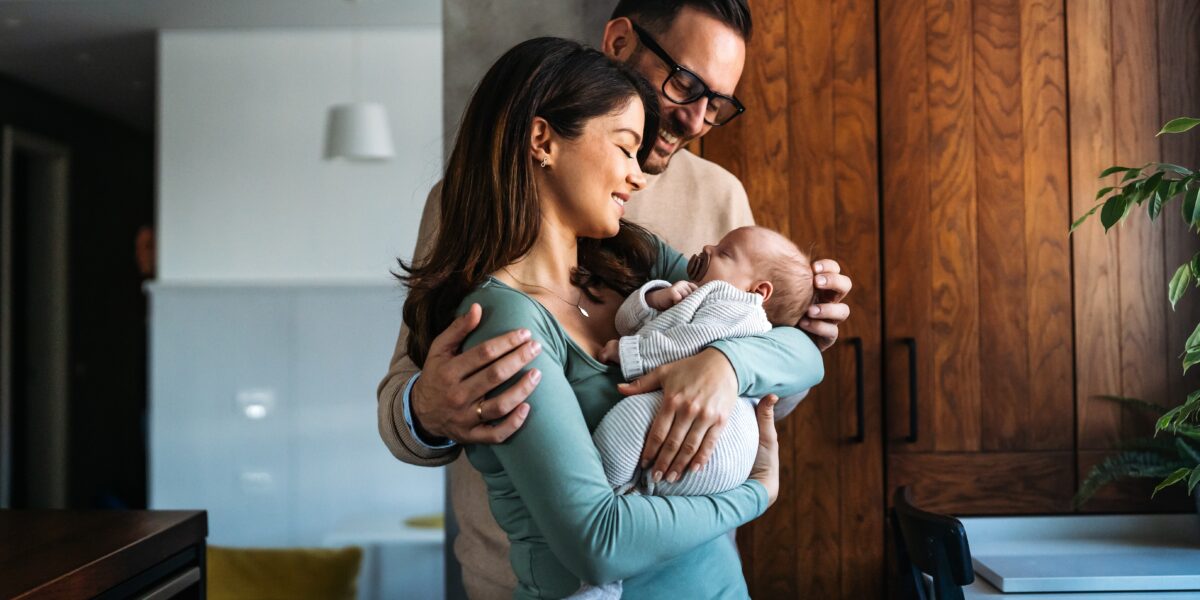 couple holding new baby