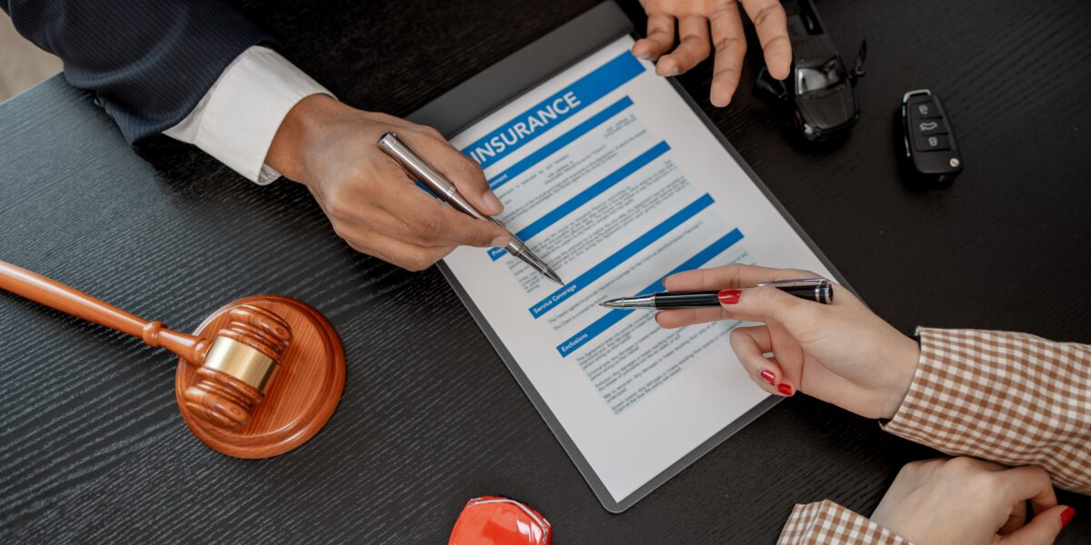 lawyer explaining the details of car insurance document